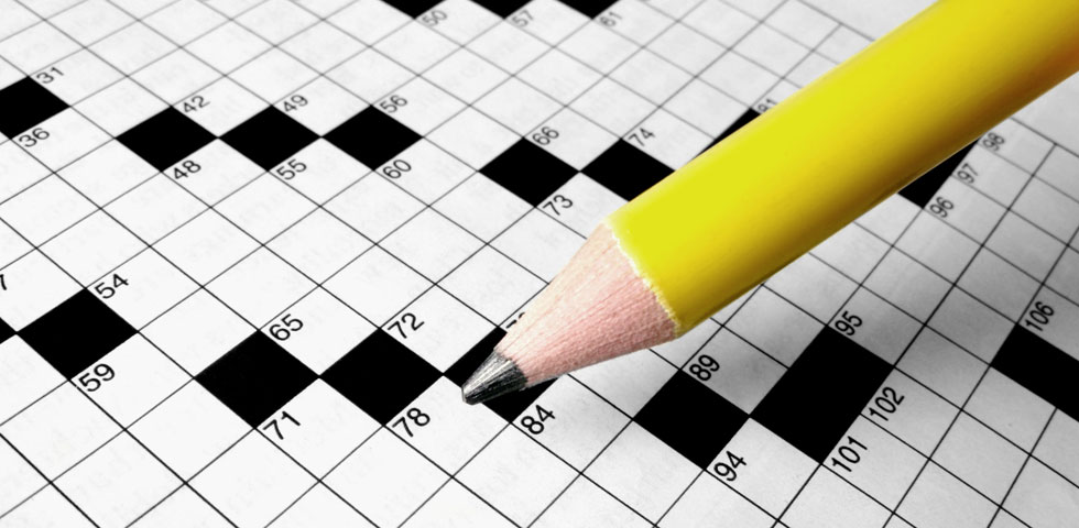Close-up of crossword puzzle with copy space in squares