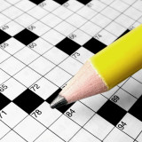 Close-up of crossword puzzle with copy space in squares